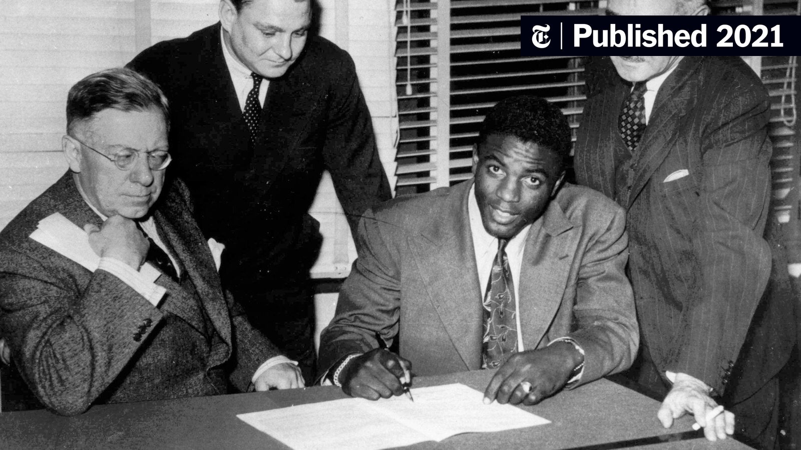 Who witnessed the jackie robinson photo signing contract event back then? See the key people involved.